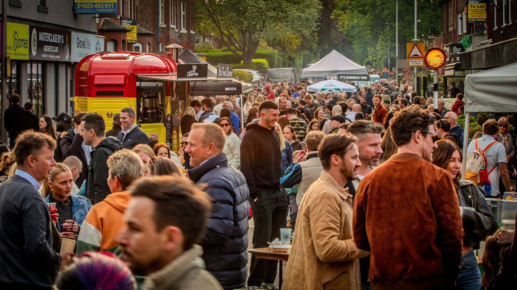 Crowds and food stalls at Wilmslow Street Fest